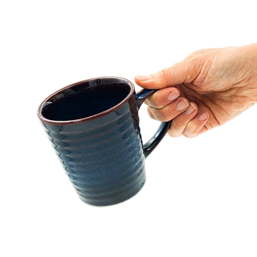 Navy Blue and Black Ceramic Coffee Mug in Hand