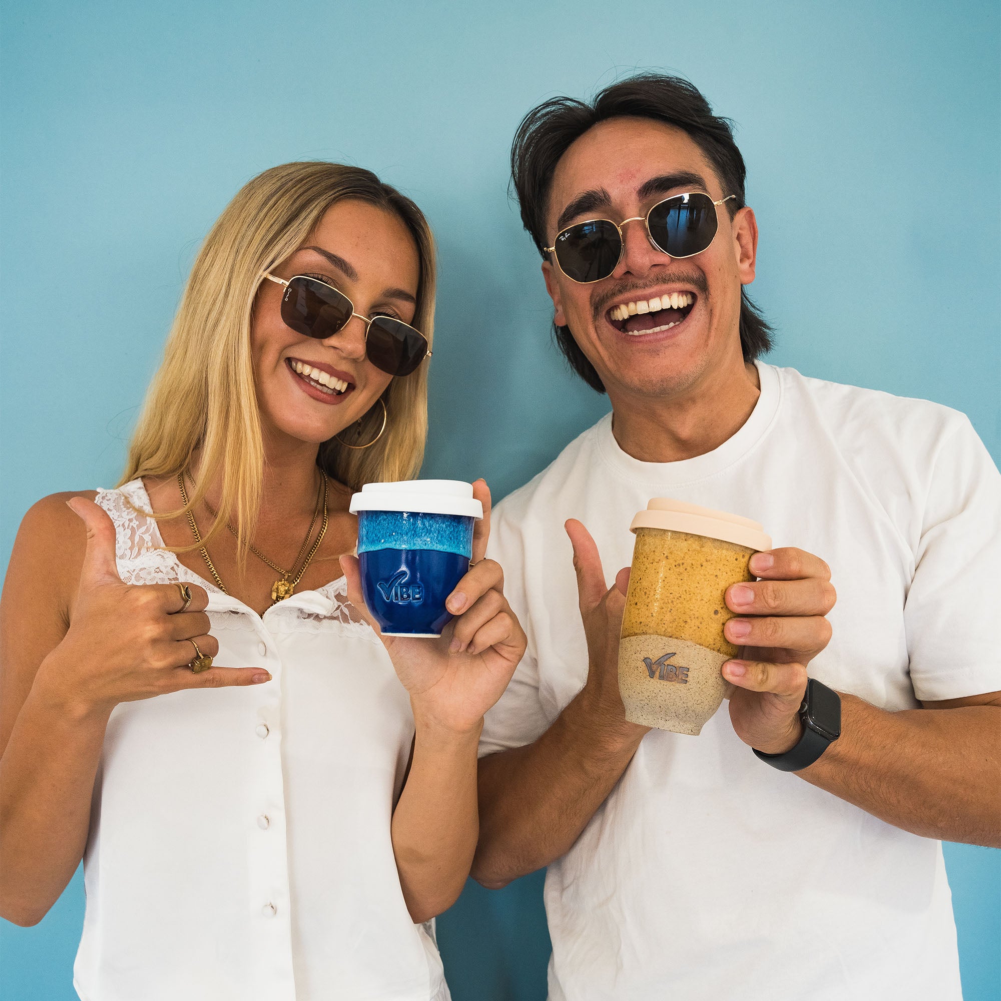 Moodshot of Vibe Travel Cup in two glazes