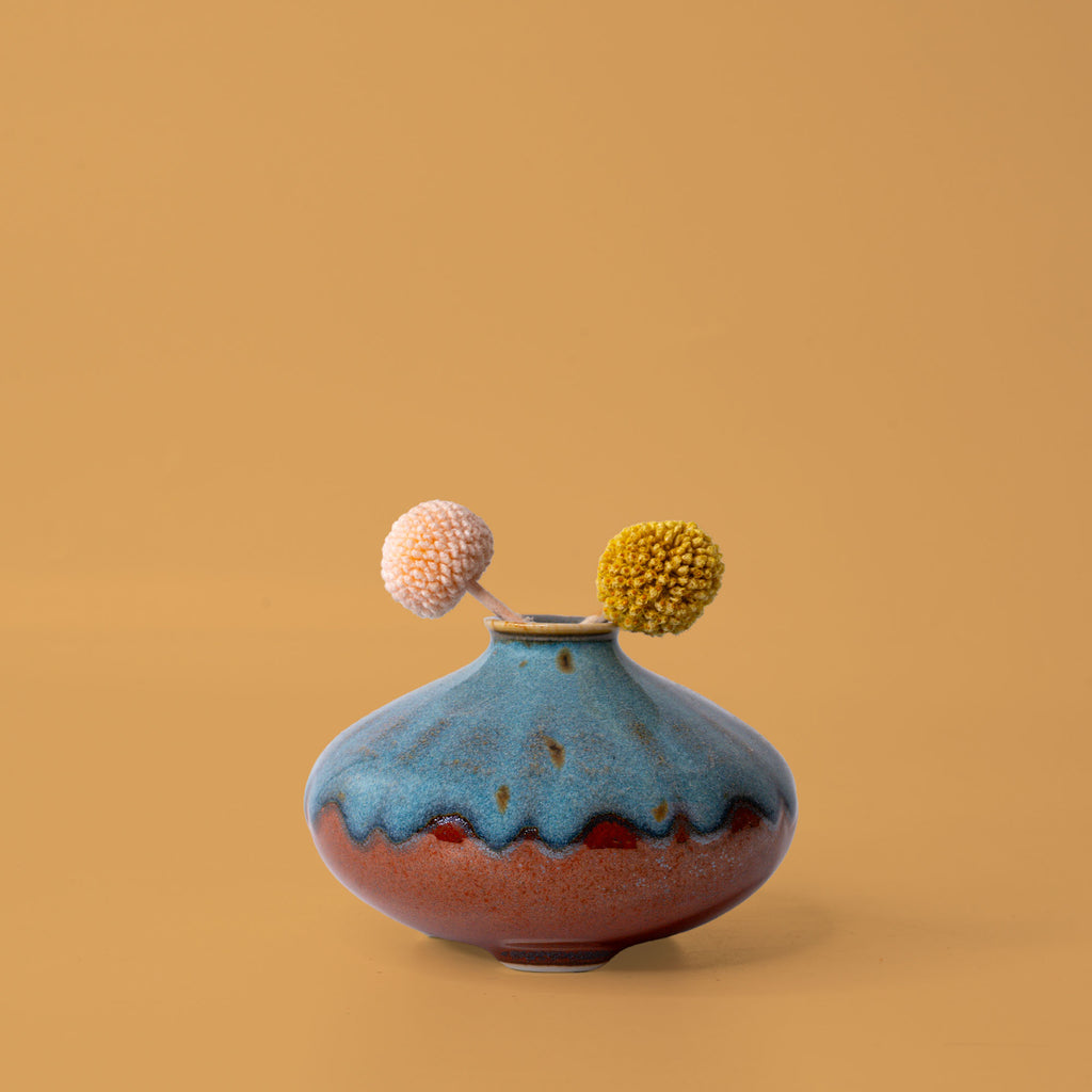 Pottery For The Planet artisan decorative vases in blue and brown with dried floral accents