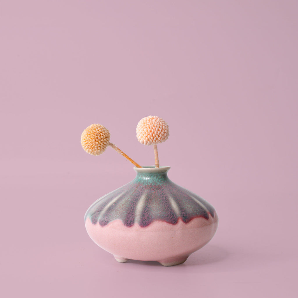 Pottery For The Planet artisan decorative vases with pink and teal glaze holding dried flowers