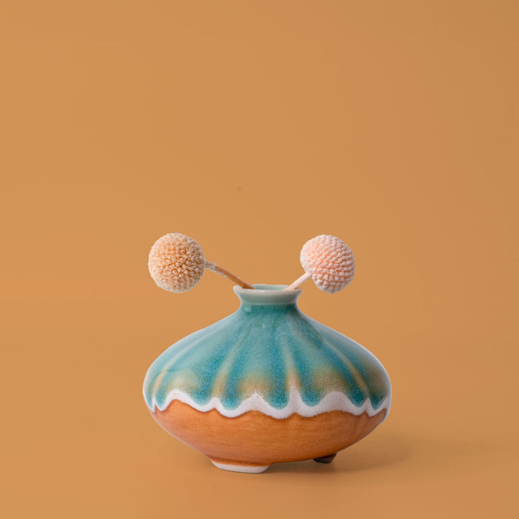 Pottery For The Planet artisan decorative vases with turquoise and terracotta glaze holding dried flowers