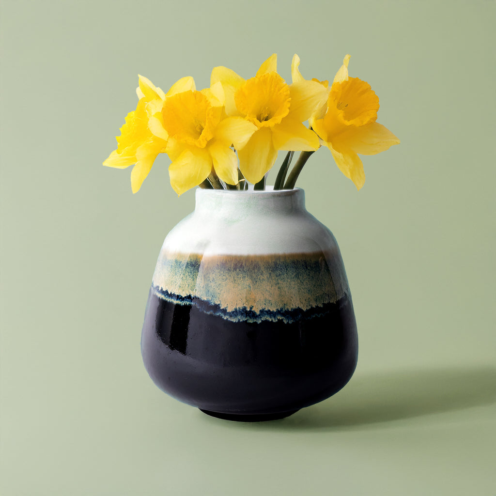 Pottery For The Planet ceramic bouquet vase for home decor with yellow daffodils on green background