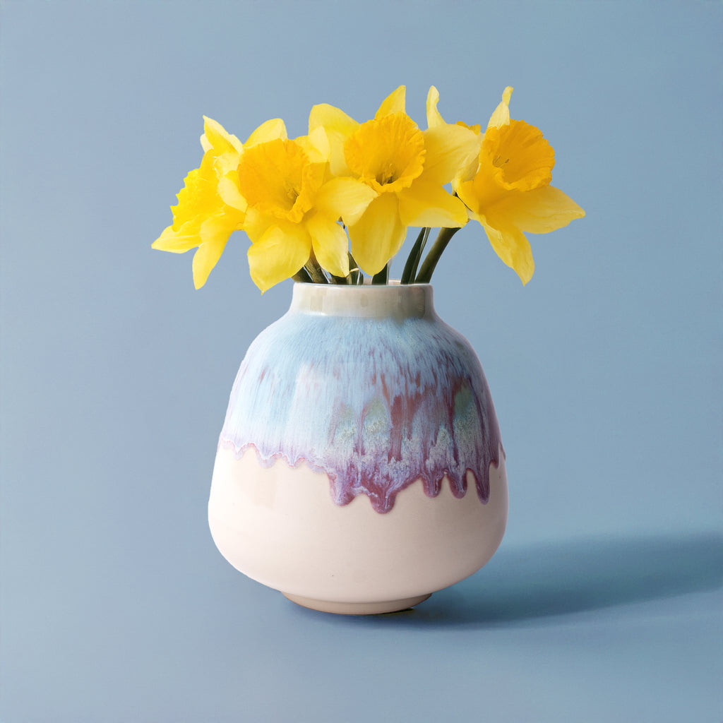 Pottery For The Planet ceramic bouquet vase for home decor with yellow flowers on blue background