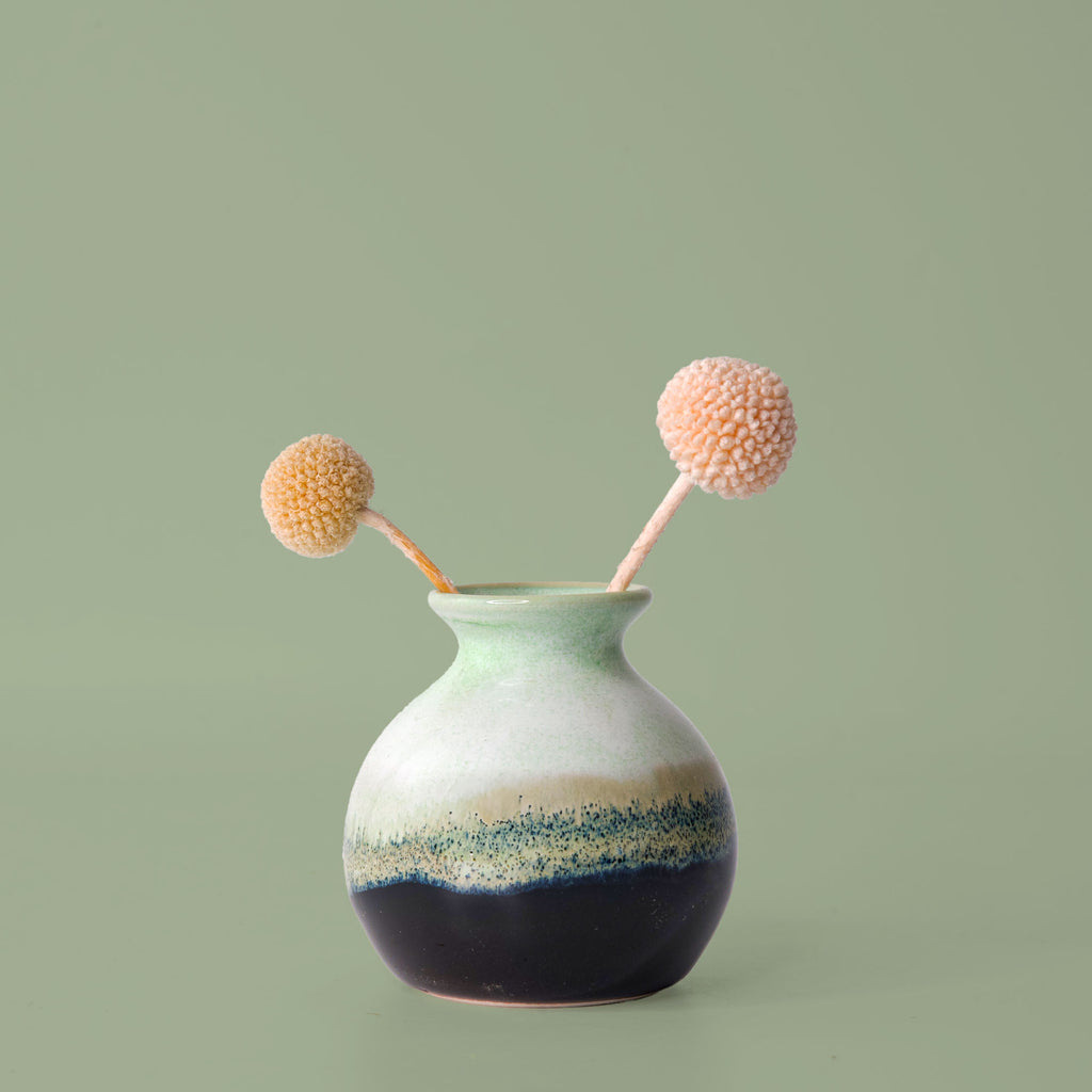 Eco-friendly home decor vase by Pottery For The Planet with green and black gradient glaze