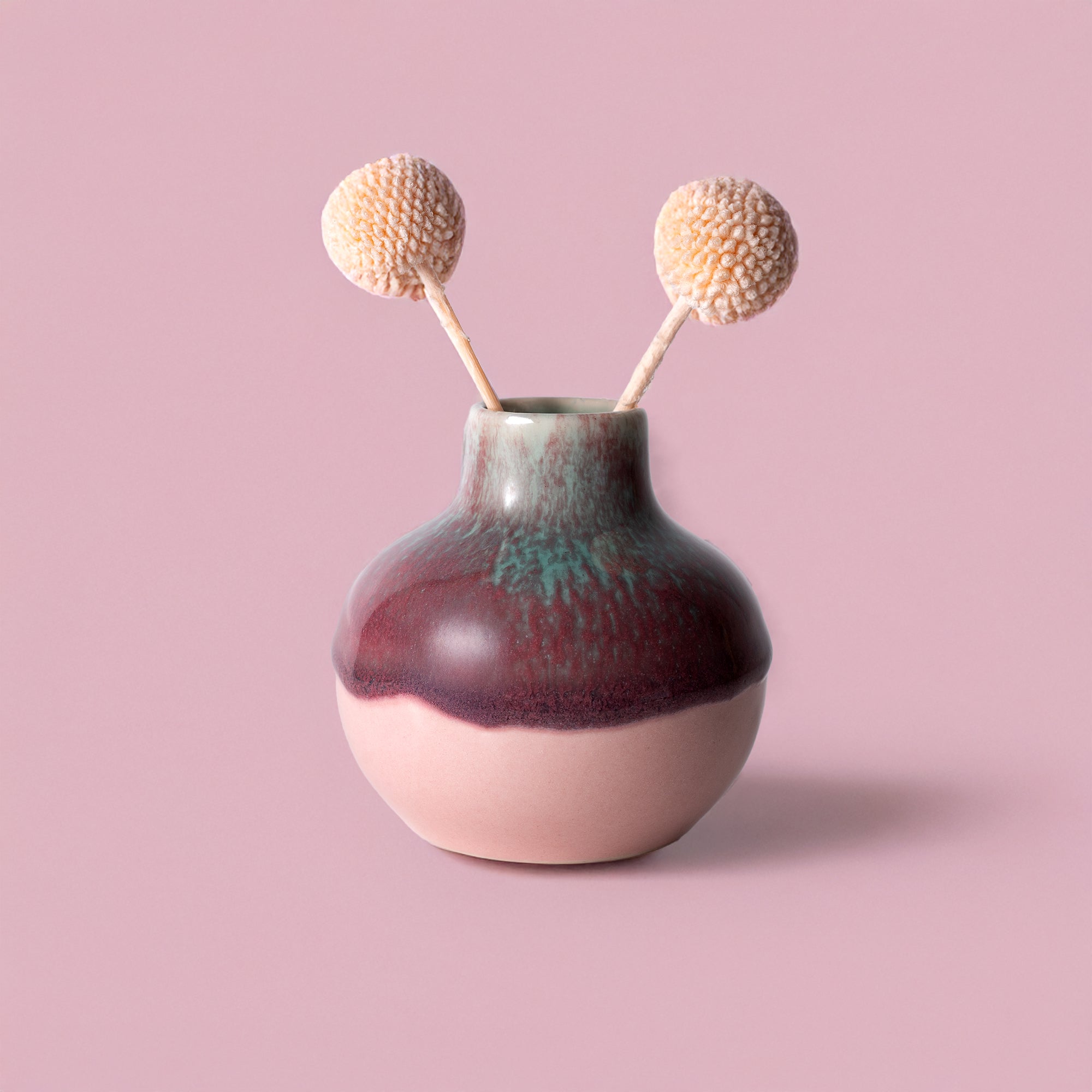 Small handmade home decor vase with round shape and two dried billy ball flowers by Pottery For The Planet