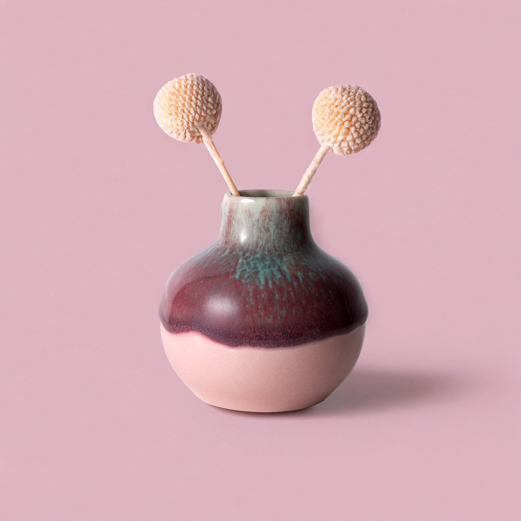 Small handmade home decor vase with round shape and two dried billy ball flowers by Pottery For The Planet