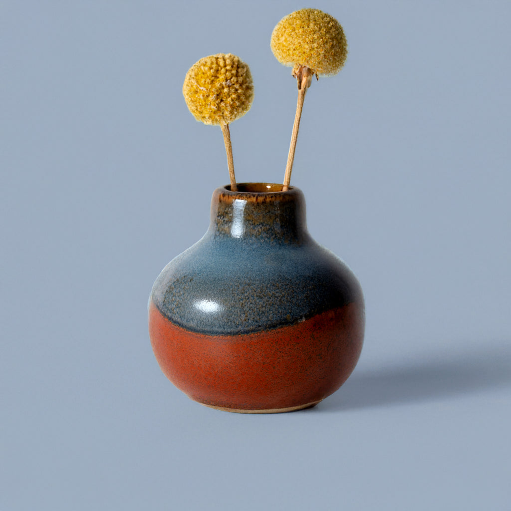 Small handmade home decor vase in blue and brown with dried yellow flowers by Pottery For The Planet