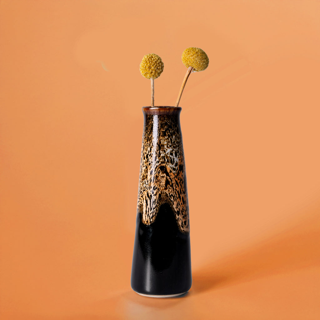Tall Pottery For The Planet sustainable home decor vase with brown and black glaze and yellow billy ball flowers