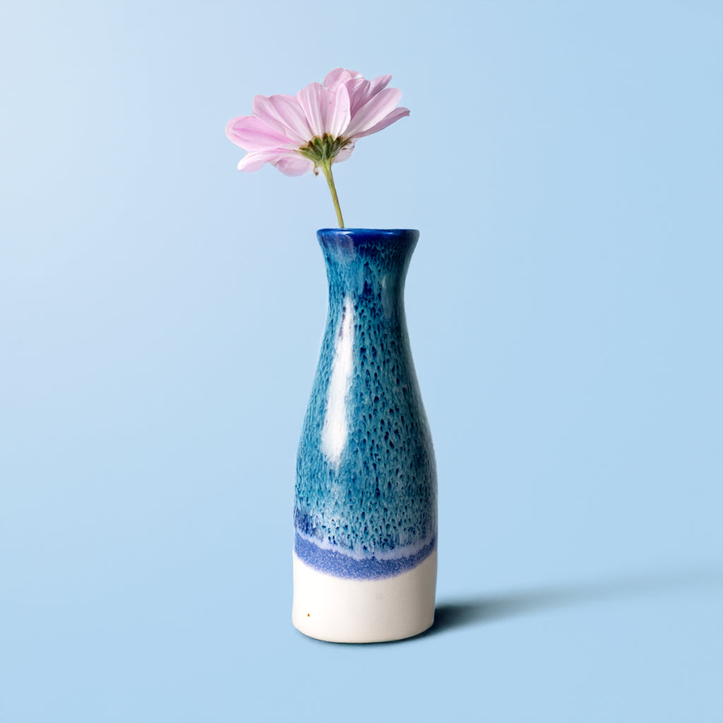 Pottery For The Planet unique ceramic flower vase in blue and white with a single pink flower