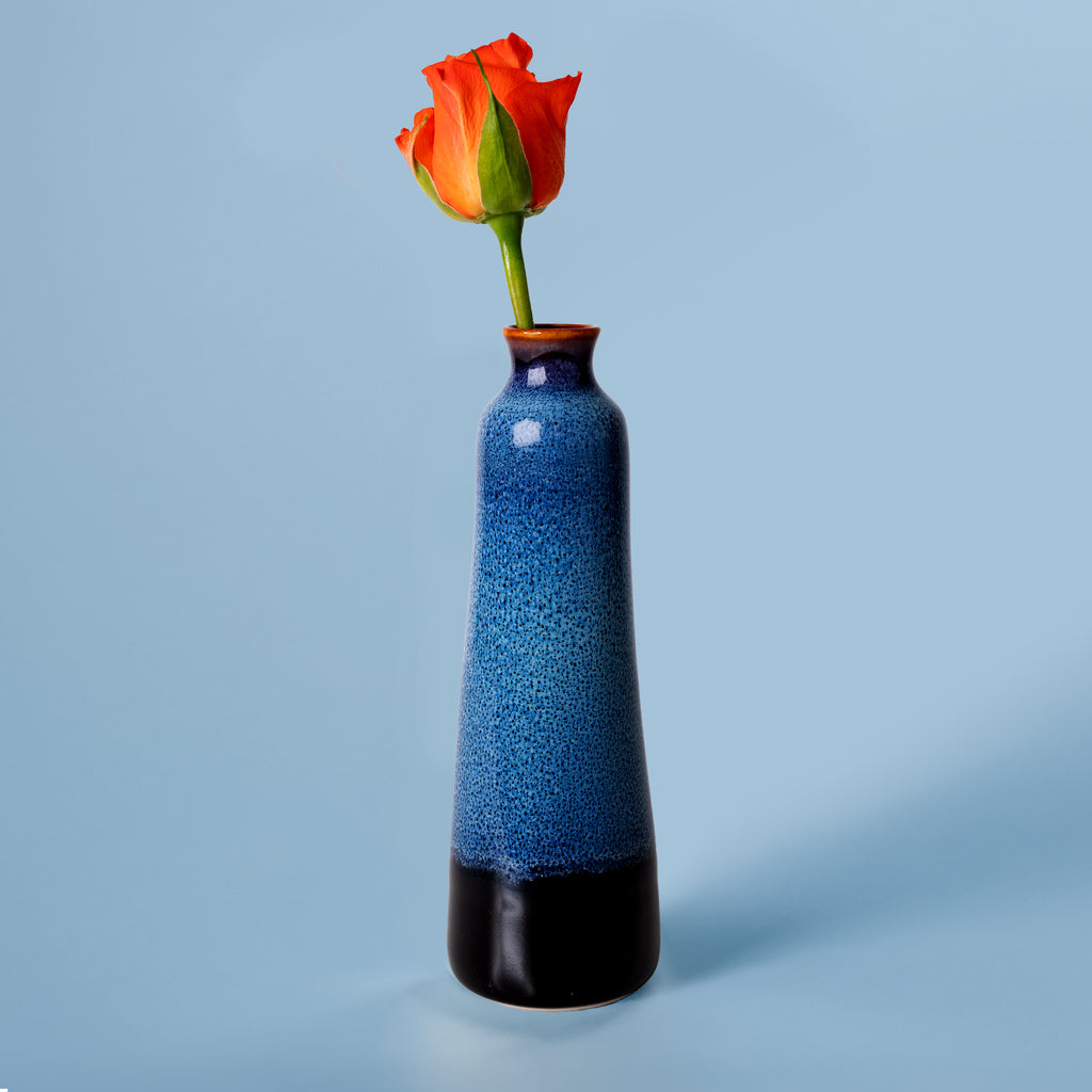 Unique handmade ceramic vase in blue and black with an orange rose by Pottery For The Planet