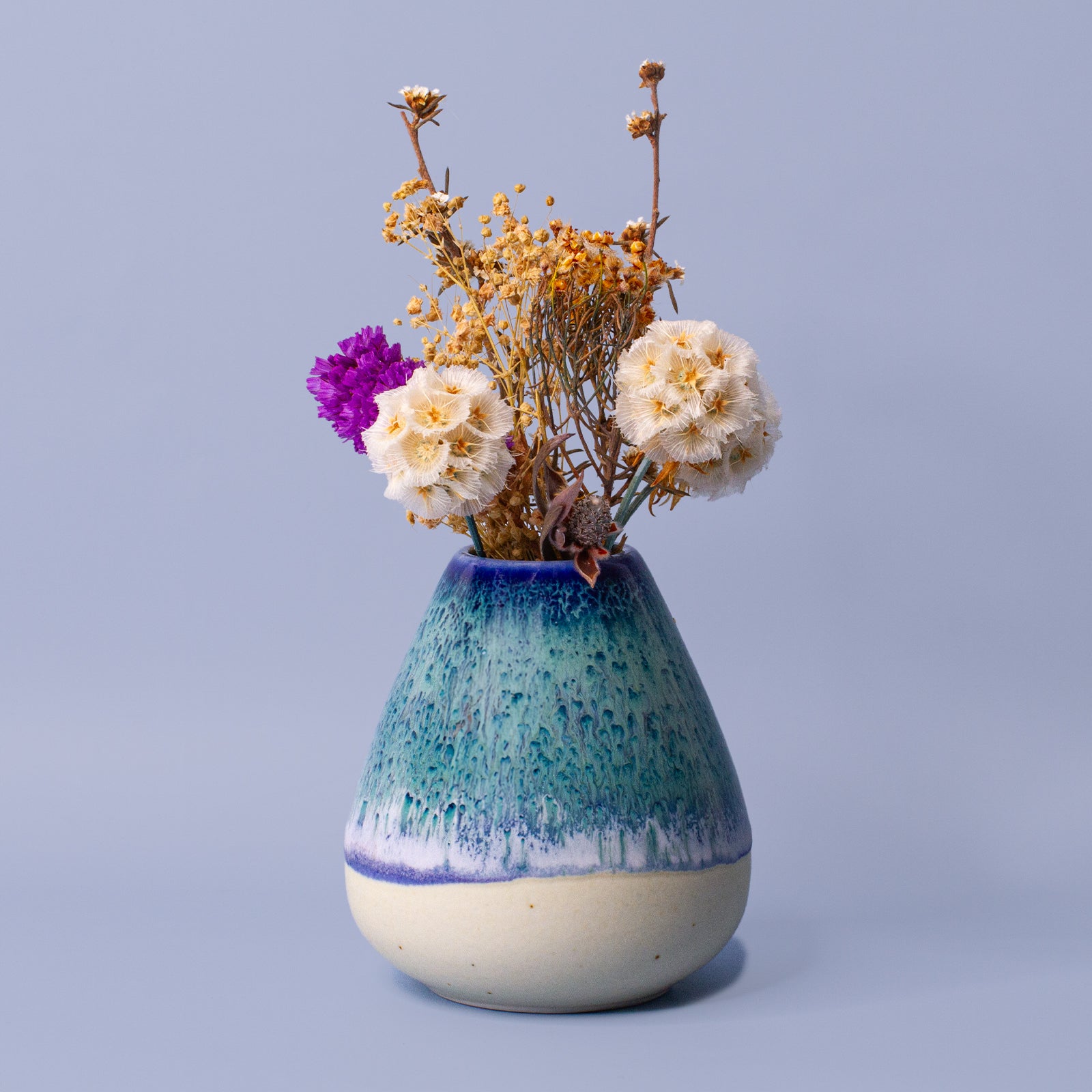 Pottery For The Planet unique pottery flower vase with blue and green glaze holding dried flowers