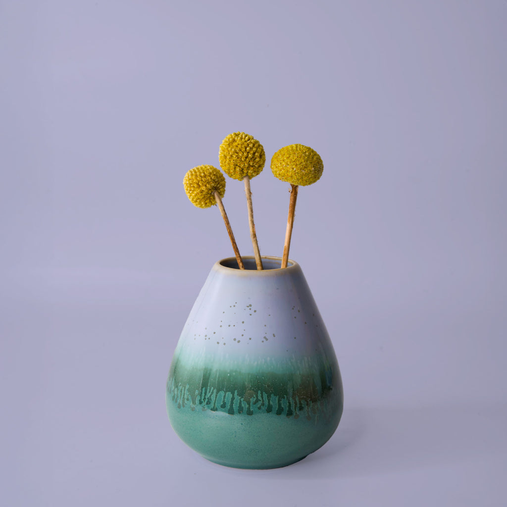 Pottery For The Planet unique pottery flower vase in green and white with yellow billy ball flowers