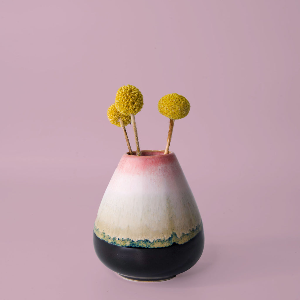 Unique pottery flower vase by Pottery For The Planet with gradient colors holding yellow billy ball flowers