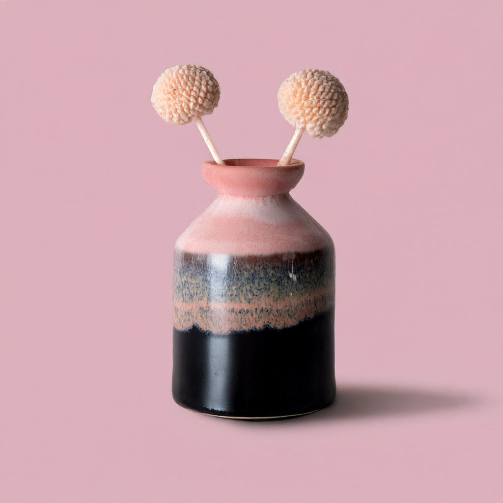 Pottery For The Planet miniature decorative vase for shelf with pink and black glaze holding dried flowers