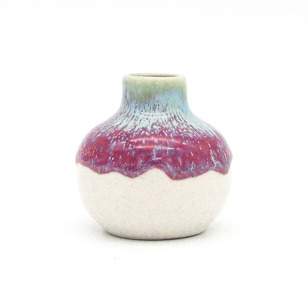 Small handmade home decor vase with textured green and purple glaze by Pottery For The Planet